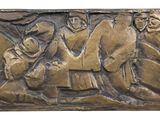an image of a bronze plaque depicting a group of people on horseback