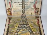 an old book with a picture of the eiffel tower on it