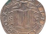 an old coin with a bird on top of it