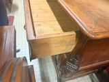 a wooden desk with a drawer underneath it