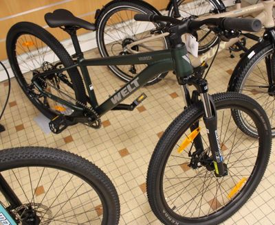several bikes are lined up in a row on the floor