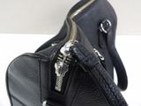 a black bag with a zipper on it sitting on a table