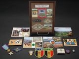 a display case with a lot of medals and pictures on it