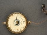 a clock with a chain around it on a table