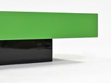 a close up of a green and black bench on a white background