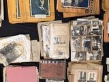 a lot of old photos on a black table