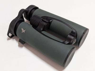 a pair of binoculars sitting on a white surface