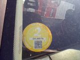 a yellow sticker on the back window of a car