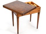 a small wooden table with a drawer on top of it