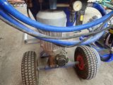 an image of a machine with a hose attached to it ' s side