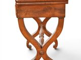 an old wooden table with a drawer on top of it