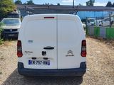 a white van parked on the side of the road