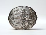 an image of a close up of a metal object on a white surface