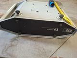 a machine that is sitting on the ground in the garage