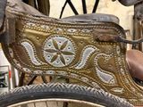 a close up of a bike with a saddle on it