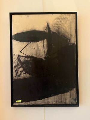 a black and white photo of a painting on the wall