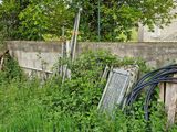 a fence that has a bunch of junk in it