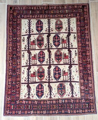 an oriental rug on a tile floor with a wooden floor