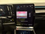 a car dashboard with a laptop and a monitor in it