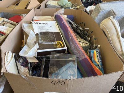 a cardboard box filled with books and other items