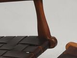 a brown chair and a brown chair on a white floor