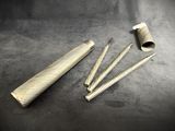 a close up of a pair of scissors and a tube on a table