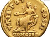a close up of a gold coin with an image of a man on a horse