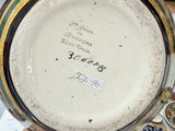 a person holding a plate with a picture on it
