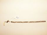 a chain that is attached to the wall with a hook