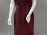an image of a mannequin dressed in a red dress
