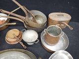 many pots and pans that are on a table