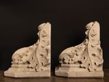 pair of white marble bookends with a dog and sheep design