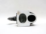 a small black and white object on a white surface