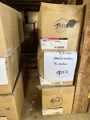 many boxes stacked on top of each other in a room
