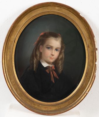 portrait of a young girl in a black dress with a red bow