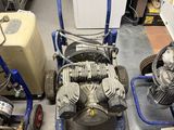 two machines sitting next to each other on the floor