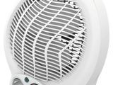 a white electric fan heater sitting on top of a white table