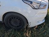 a white van that is parked in the grass