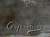 a close up of a metal object with the word cappuccino written on it