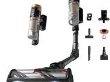 a vacuum that is sitting on the floor next to other items