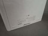 underside view of a white refrigerator freezer sitting on top of a counter