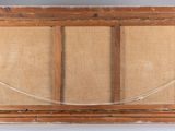 an old picture frame with a rope hanging from it ' s side