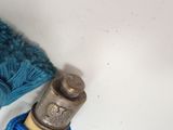 a blue ball of yarn next to a spool of yarn and a spool of thread