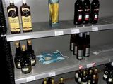 many bottles of alcohol on the shelves in the store