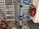 a pile of tools sitting on the floor next to a fire hydrant