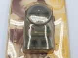 a plastic package with a magnifying device inside of it