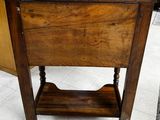 a small wooden table with a drawer underneath it