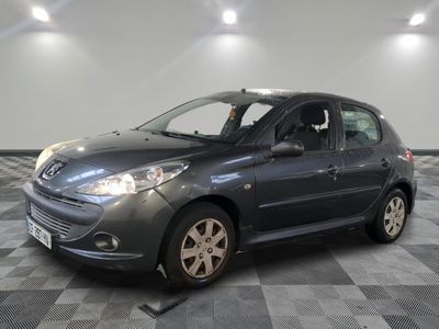 a picture of a small grey car in a showroom