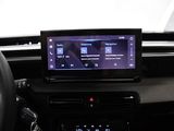 the dashboard of a car with a car radio and a steering wheel
