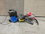 two wet dryers and a vacuum on the sidewalk